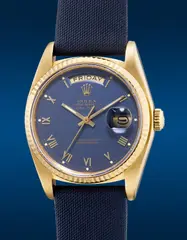 Rolex, A fine and attractive yellow gold wristwatch with center seconds, day, applied Roman numerals and deep blue dial, Circa 1983