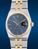 Rolex, A fine and "like-new" stainless steel and yellow gold quartz wristwatch with center seconds, date, blue dial and bracelet, Circa 1977