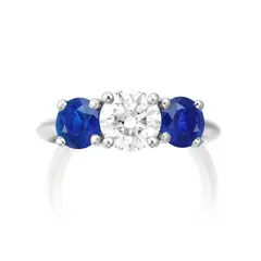 Tiffany & Co., A Diamond and Sapphire Ring, - One brilliant-cut diamond, 1.02 carats - Two circular-cut sapphires on the sides, approximately 1.00 carats total - Platinum - Signed Tiffany & Co., numbered - Ring size 5 Accompanied by a Tiffany & Co. case and Tiffany & Co. Diamond Certificate