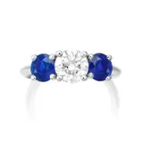 A Diamond and Sapphire Ring by Tiffany & Co., - One brilliant-cut diamond, 1.02 carats - Two circular-cut sapphires on the sides, approximately 1.00 carats total - Pl, sold Mar 2022