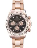 Rolex, An attractive and well-preserved pink gold chronograph wristwatch with bracelet, guarantee and presentation box