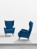 Pair of wing-back armchairs, designed for the Hotel Royal, Naples by Gio Ponti, circa 1956, walnut, fabric, sold Jun 2021