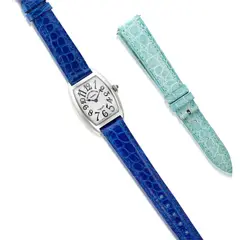 Franck Muller, A Lady's Fine White Gold Tonneau-shaped 'Cintrée Curvex' Wristwatch, Circa 2000's, - 18K white gold - Quartz movement - Crocodile strap - Dial, case, strap and buckle signed Franck Muller, numbered with Swiss assay mark for gold - Case length 3.5 cm, width 2.5 cm Accompanied by an additional Franck Muller light blue crocodile strap Potential bidders who intend to export this lot are advised that certain permits may be required. Please contact the Jewels Department prior to bidding on this lot. 出口次拍品可能需要相關許可證明文件。如有意競投此拍品，請在拍賣會舉行前與珠寶部聯絡。