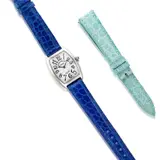 Franck Muller, A Lady's Fine White Gold Tonneau-shaped 'Cintrée Curvex' Wristwatch, Circa 2000's, - 18K white gold - Quartz movement - Crocodile strap - Dial, case, strap and buckle signed Franck Muller, numbered with Swiss assay mark for gold - Case length 3.5 cm, width 2.5 cm Accompanied by an additional Franck Muller light blue crocodile strap Potential bidders who intend to export this lot are advised that certain permits may be required. Please contact the Jewels Department prior to bidding on this lot. 出口次拍品可能需要相關許可證明文件。如有意競投此拍品，請在拍賣會舉行前與珠寶部聯絡。