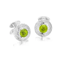 William & Son, A Pair of Carved Peridot and Diamond Cufflinks, - Two carved peridots - Sixty four brilliant-cut diamonds - 18K white gold - Signed William & Son - Maker's mark and with British hallmarks - Length 2.8 cm, width 2.2 cm Accompanied by a William & Son navy paper box
