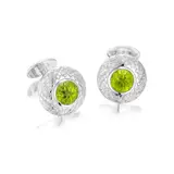 William & Son, A Pair of Carved Peridot and Diamond Cufflinks, - Two carved peridots - Sixty four brilliant-cut diamonds - 18K white gold - Signed William & Son - Maker's mark and with British hallmarks - Length 2.8 cm, width 2.2 cm Accompanied by a William & Son navy paper box