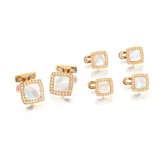 William & Son, A Mother-of-Pearl and Diamond Dress-set, - Six mother-of-pearl plaques - One hundred and forty four brilliant-cut diamonds - 18K pink gold - Maker's mark and with British hallmarks - Cufflinks length 2.3 cm, width 1.4 cm - Shirt studs length 0.8 cm, width 1.1 cm Accompanied by a William & Son navy leatherette case