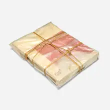 Wrapped Book (Modern Art) by Christo, 1978, hardcover book 'Modern Art' by Sam Hunter and John Jacobus, transparent polyethylene, twine and cord, sold Apr 2024
