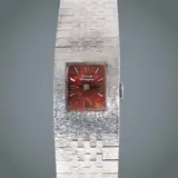 Untitled by Girard-Perregaux ladies’ cocktail watch, Material: Typically crafted in white gold-plated metal. <br> Design Aesthetic: It features a textured, brick/ block-patt, sold Jul 2026