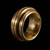 A Piaget Possession Ring in 18k, Untitled, The iconic Piaget Possession ring first launched in 1990 with the spinning band design in 18k yellow gold. <br> The piece symbolizes infinite love, luck and “ability to own the moment” with every playful turn. <br> Signed Piaget 1992 <br> Hallmarked 750 <br> Numbered A08124 <br> Weighs 17.10 grams