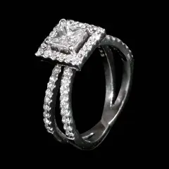A Diamond Ring in 14k, Untitled, The ring designed with a double band is centered by a princess cut diamond weighing approximately 0.70 cts. <br> The center stone is surrounded by a halo of diamonds with additional diamond accents on the band weighing approximately 0.56 cts. <br> Weighs 4.30 grams. <br> Some stones noted as Refer on the GIA iD100®