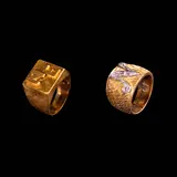 Untitled by A Pair of Rings, a.) A Monogram Ring in 18k <br> Crafted in 18k yellow gold, the ring features an “NE” monogram on the face, complemented, sold Jul 2026