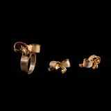 Untitled by A Set of Ribbon Jewelry in 8k, Set in 8k yellow gold, this matching ring and earring set features sculpted ribbon motifs. <br> The pieces weigh 3.80 gr, sold Jul 2026