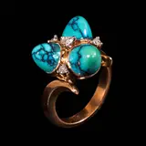 A Turquoise and Diamond Ring in 14k, Untitled, Set in 14k two-toned rose and white gold, the ring is set with sugarloaf turquoise cabochons accented by diamonds totaling approximately 0.19 cts. <br> Weighs 7.70 grams <br> Diamonds noted as Pass on the GIA iD100®