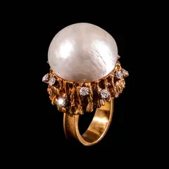 A Dramatic Pearl Cocktail Ring in 14k, Untitled, Designed in a free-form, naturalistic brutalist setting, a 20mm button pearl centers the ring in 14k yellow gold. It is accented by diamonds totaling approximately 0.60 cts. <br> Weighs 23.20 grams. <br> Diamonds noted as Pass on the GIA iD100®