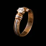 Untitled by A Classic Diamond Ring Band in 14k, The diamond weighing approximately 0.25 cts is set in a classic two-toned 14k yellow and white gold ring setting. <br> W, sold Jul 2026