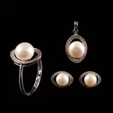 Untitled by A Set of Pearl and Diamond Jewelry in 18k, The set features a matching pendant, ring, and earrings in 18k white gold. <br> The pieces are designed in a classic sty, sold Jul 2026