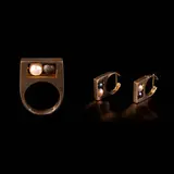 Untitled by A Set of Movable Black and White Pearl Jewelry in 14k, Designed as minimalist pieces inspired by 1960s Dinh Van designs.<br> The set consists of a ring and earrings in 14k yel, sold Jul 2026