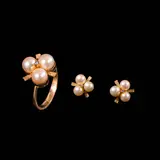 Untitled by A Collection of Pearl and Diamond Jewelry in 14k, The matching set in 14k yellow gold features a ring and earrings, designed in a floral motif. The pearls are accented by, sold Jul 2026