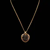 A Heart Pendant Necklace, Untitled, A statement smoky quartz heart pendant in 14k yellow gold hangs from a 25-inch spiga chain in 18k yellow gold. <br> Weighs 29.50 grams.