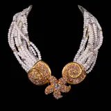 A Barrera Torsade Necklace, Untitled, The necklace is made of sixteen strands of faux pearls and mixed beads. The piece is anchored by an ornate, sculptural copper clasp showcasing a starfish and seashell motif, embellished with multicolored crystals. <br> The necklace length is 17 inches. <br> Weighs 147.60 grams
