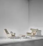 Two early 'Ox' lounge armchairs, model nos. AP-46 and AP-47, and ottoman, model no. AP-49 by Hans J. Wegner, designed 1960, produced 1960s, chromium-plated steel, fabric, leather, sold Nov 2018