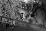 Laura Wilson, Unidentified Man Crossing Rio Grande, The International Bridge Laredo, Texas, May 15, 1994, Gelatin silver print