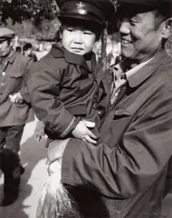 Man Holding Young Boy by Andy Warhol, 1982, Gelatin silver print, sold May 2017