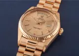 Rolex, A very rare and unusual pink gold calendar wristwatch with bracelet, centre seconds and rare pink honeycomb dial