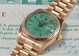 Rolex, A rare and attractive yellow gold calendar wristwatch with bracelet, centre seconds, turquoise lacquered “Stella” dial, original guarantee and box