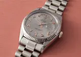 Rolex, An extremely rare and highly important white gold wristwatch with Arabic calendar, pink gold applied Arabic numerals, centre seconds, bracelet and unusual tapisserie dial