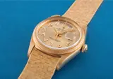Rolex, A very rare and important yellow gold calendar wristwatch with applied Arabic numerals, centre seconds, champagne dial and big logo bracelet