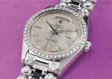 Rolex, An extremely rare and important white gold diamond and sapphire-set calendar wristwatch with centre seconds and stone-set bracelet
