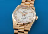 Rolex, A very rare and unusual yellow gold automatic calendar wristwatch with centre seconds, bracelet and marble hard stone dial