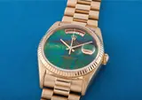 Rolex, A very rare and unusual yellow gold calendar wristwatch with centre seconds, bracelet and opal hard stone dial