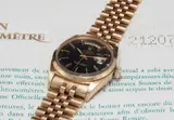 Rolex, A rare yellow gold calendar wristwatch with bracelet, centre seconds, black lacquered “Stella” dial and Attestation de Chronometer Officiel