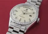 Rolex, A very rare and highly unusual platinum and diamond-set calendar wristwatch with bracelet, centre seconds and rare linear geometric engraved dial, 1961