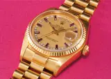 Rolex, A rare and attractive yellow gold, diamond and ruby-set calendar wristwatch with centre seconds, bracelet and champagne dial