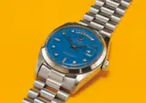 Rolex, A very rare and attractive white gold and diamond-set calendar wristwatch with bracelet, centre seconds and blue lacquered “Stella” dial