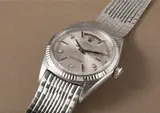 Rolex, A very rare and attractive white gold and diamond-set calendar wristwatch with centre seconds, argenté dial and unusual tile link bracelet
