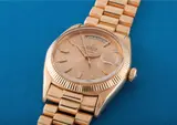 Rolex, An extremely rare and historically important pink gold calendar wristwatch with centre seconds, red and black date, bracelet and pink dial with no chronometer certification