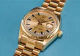 Rolex, A rare and attractive yellow gold, diamond and sapphire-set calendar wristwatch with centre seconds, bracelet and champagne dial