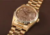 Rolex, A very rare and unusual yellow gold and diamond-set calendar wristwatch with bracelet, centre seconds and fossil hard stone dial