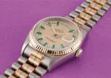 Rolex, A very rare three color gold, diamond and emerald-set calendar wristwatch with bracelet, centre seconds and champagne dial