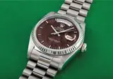 Rolex, A very rare and unusual white gold calendar wristwatch with centre seconds, bracelet and mahogany dial