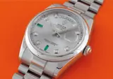 Rolex, A rare and heavy platinum, diamond and emerald-set calendar wristwatch with centre seconds, bracelet, original guarantee card, product literature and fitted presentation box