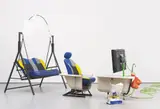 Heather Phillipson, PRIVATE PARTS PICTURES PRESENTS, 2014, HD video, metal swinging garden seat, spray painted car seats, painted card, acrylic bathtub, plastic clip, bath taps, spray painted table leg, paper potato sacks, bricks, speakers, speakers, watermelons, potatoes, mesh bags, electrical cord, bungee cords