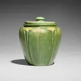 Rare tobacco jar with leaves and flowers by Wilhelmina Post for Grueby Faience Company, 1898-1910, glazed earthenware, sold Sep 2025