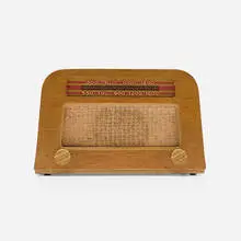 Radio by Charles and Ray Eames, 1946, oak veneer, cloth, screen-printed glass, plastic, sold Feb 2024