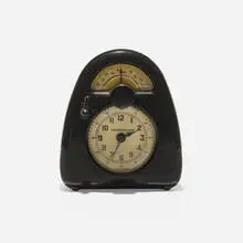 Isamu Noguchi, Measured Time clock and kitchen timer, c. 1932, Bakelite, glass, plastic, printed paper